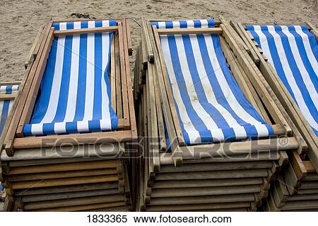 Stock Photography - Pile of folded up beach chairs, Scarborough, Yorkshire, England, Europe . Fotosearch