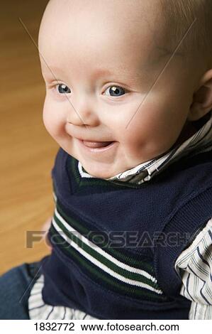 Portrait of a smiling baby View Large Photo Image Stock Image - Portrait of a smiling baby. Fotosearch