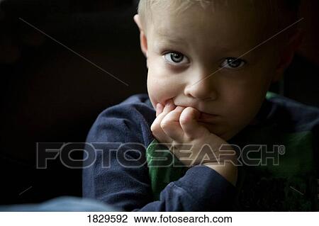 Stock Image - Portrait of a young boy. Fotosearch