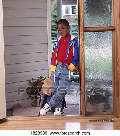 Stock Photo - Portrait of boy with a backpack. Fotosearch