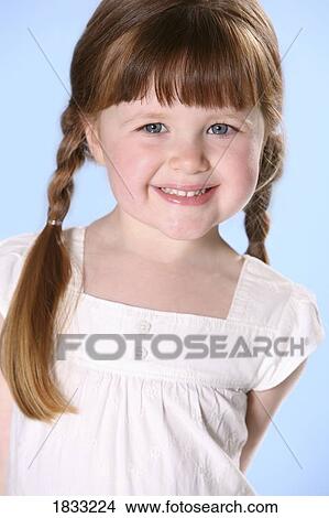 Picture - Portrait of little girl with braids. Fotosearch