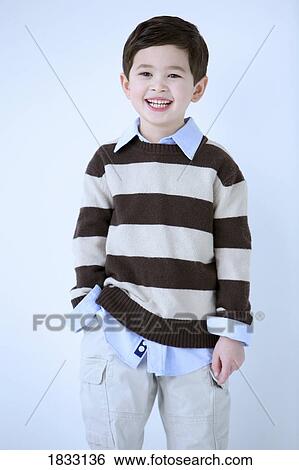 Portrait of young boy in striped shirt View Large Photo Image Stock Photograph - Portrait of young boy in striped shirt. Fotosearch