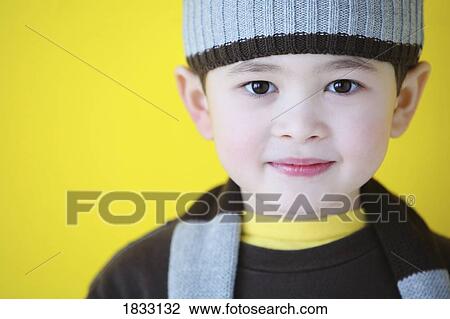 Stock Image - Portrait of young boy. Fotosearch