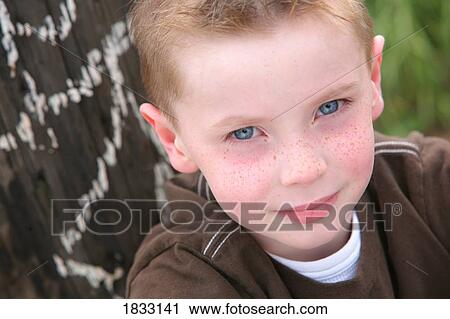 Stock Image - Portrait of young boy. Fotosearch