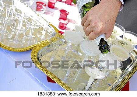 Stock Photo - Pouring champagne. Fotosearch