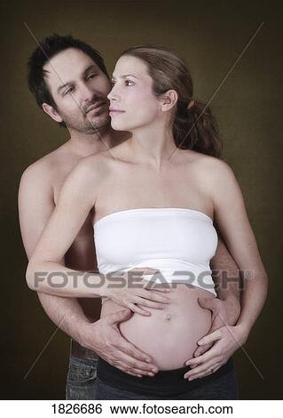 Stock Photograph - Pregnant couple. Fotosearch