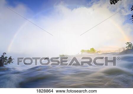 Picture - Rainbow over Eastern Cataract, Victoria Falls, Zambezi River, Zambia, Africa. Fotosearch