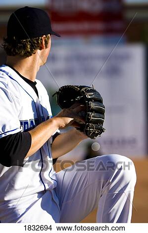 Rear view of a baseball player about to throw View Large Photo Image Picture - Rear view of a baseball player about to throw. Fotosearch