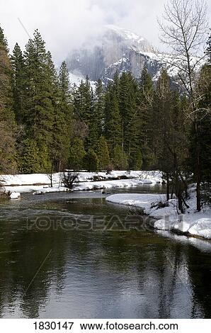 Stock Photo - River in winter landscape, Yosemite National Park, USA. Fotosearch