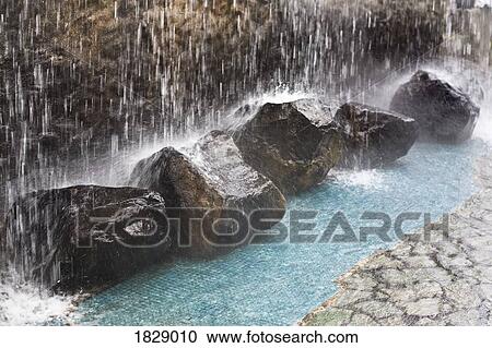 Rocks under waterfall View Large Photo Image Stock Image - Rocks under waterfall. Fotosearch