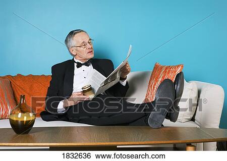 Stock Photograph - Senior Man Reading The Newspaper. Fotosearch