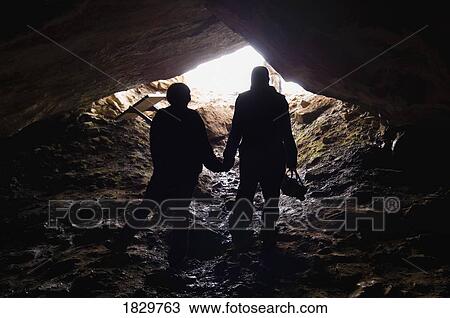 Silhouette of two climbers in cave, Cadomin, Alberta, Canada View Large Photo Image Stock Image - Silhouette of two climbers in cave, Cadomin, Alberta, Canada. Fotosearch