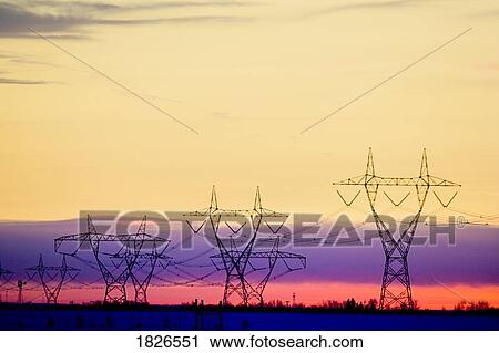 Silhouetted transmission towers View Large Photo Image Stock Image - Silhouetted transmission towers. Fotosearch