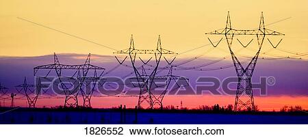 Stock Image - Silhouetted transmission towers. Fotosearch