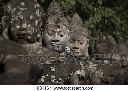 Statues lining main gates of ancient city, Angkor Wat, Cambodia View Large Photo Image Stock Photo - Statues lining main gates of ancient city, Angkor Wat, Cambodia. Fotosearch