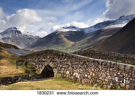 Stone bridge in mountain landscape, Lake District, Cumbria, England View Large Photo Image Stock Image - Stone bridge in mountain landscape, Lake District, Cumbria, England. Fotosearch
