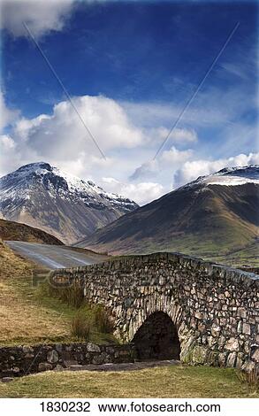Stone bridge in mountain landscape, Lake District, Cumbria, England View Large Photo Image Stock Image - Stone bridge in mountain landscape, Lake District, Cumbria, England. Fotosearch