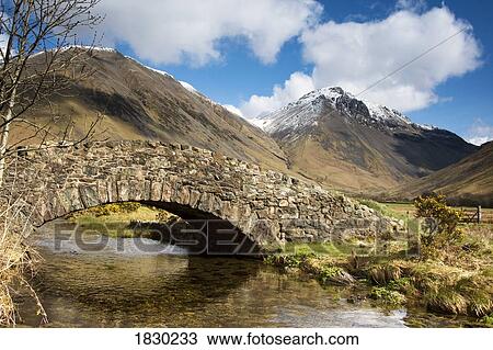 Stone bridge in mountain landscape, Lake District, Cumbria, England View Large Photo Image Stock Image - Stone bridge in mountain landscape, Lake District, Cumbria, England. Fotosearch