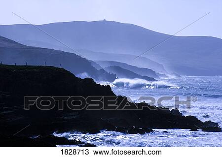 Stock Image - Stormy day at St. Finan's Bay with Bolus head in background, Co Kerry, Ireland. Fotosearch