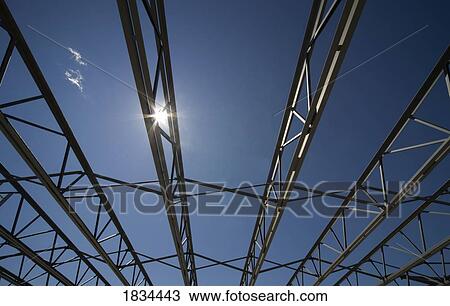 Sun shining through beams View Large Photo Image Stock Image - Sun shining through beams. Fotosearch