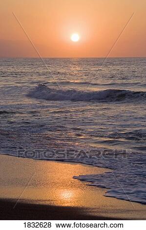 Stock Photo - Sunrise over sea . Fotosearch
