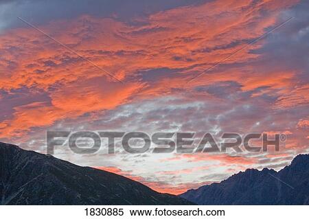 Sunset over mountain range, Mount Cook Range, New Zealand View Large Photo Image Stock Photography - Sunset over mountain range, Mount Cook Range, New Zealand. Fotosearch