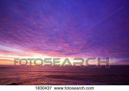 Sunset over the Pacific Ocean, Cape Kiwanda, Oregon, USA View Large Photo Image Stock Photo - Sunset over the Pacific Ocean, Cape Kiwanda, Oregon, USA. Fotosearch