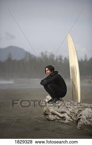 Surfer on beach, Cox Bay near Tofino, British Columbia, Canada View Large Photo Image Stock Photo - Surfer on beach, Cox Bay near Tofino, British Columbia, Canada. Fotosearch