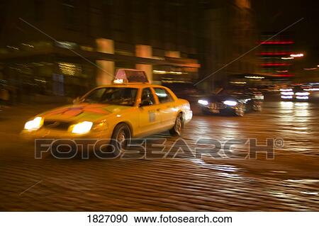 Taxi on cobblestone street, New York, USA View Large Photo Image Stock Image - Taxi on cobblestone street, New York, USA . Fotosearch