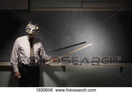 Teacher wearing a mask View Large Photo Image Stock Photograph - Teacher wearing a mask. Fotosearch
