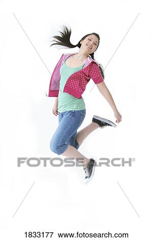 Stock Photo - Teenage girl in mid jump. Fotosearch
