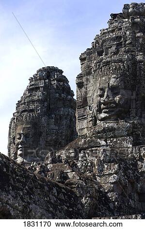 Stock Image - The faces of the Bayon temple, city of Angkor, northwestern Cambodia. Fotosearch