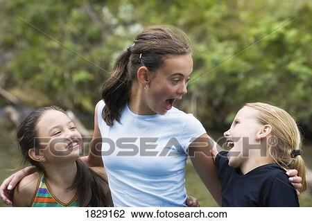 Three girls together View Large Photo Image Stock Image - Three girls together. Fotosearch