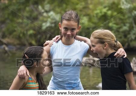 Stock Image - Three girls together. Fotosearch
