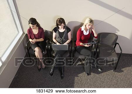 Stock Photo - Three women sitting. Fotosearch