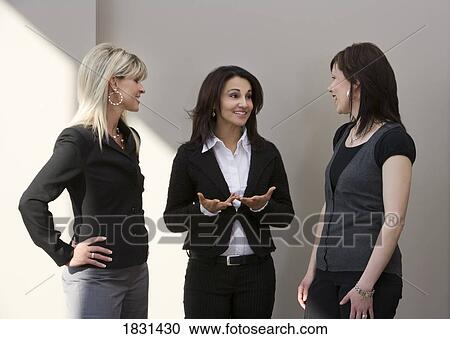 Three women talking View Large Photo Image Stock Image - Three women talking. Fotosearch