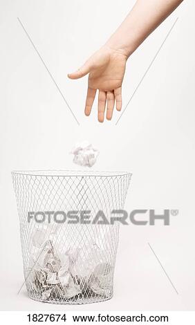 Throwing paper into the trash bin View Large Photo Image Picture - Throwing paper into the trash bin. Fotosearch