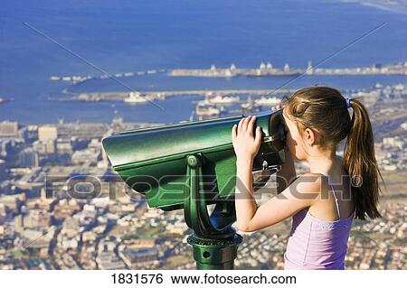 Tourist looking through binoculars at Cape Town, Table Mountain, South Africa View Large Photo Image Stock Photograph - Tourist looking through binoculars at Cape Town, Table Mountain, South Africa . Fotosearch