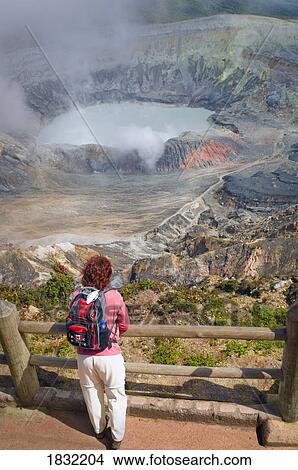 Picture - Tourist Overlooking Poás Volcano, Poás Volcano National Park, Costa Rica. Fotosearch