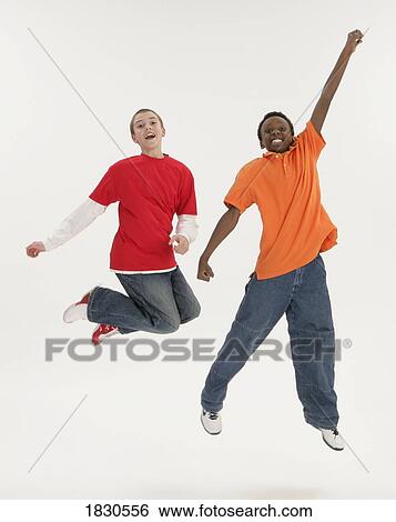 Stock Photograph - Two boys jumping. Fotosearch