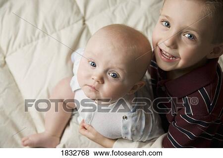 Stock Photo - Two boys sitting. Fotosearch