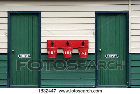 Two Doors And Buckets For Fire Prevention View Large Photo Image Stock Photo - Two Doors And Buckets For Fire Prevention. Fotosearch