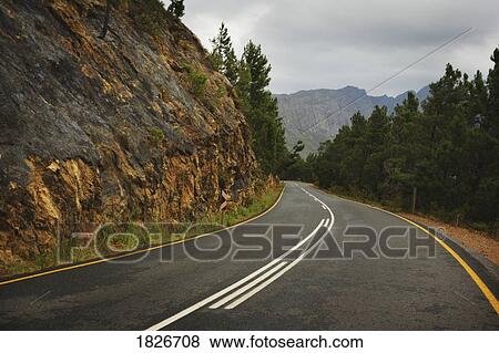 Two lane road in the mountains View Large Photo Image Stock Photo - Two lane road in the mountains. Fotosearch