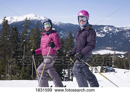 Stock Photo - Two skiers, Whistler, BC, Canada. Fotosearch