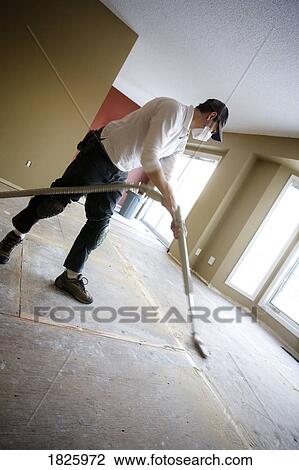 Vacuuming a floor View Large Photo Image Stock Image - Vacuuming a floor. Fotosearch