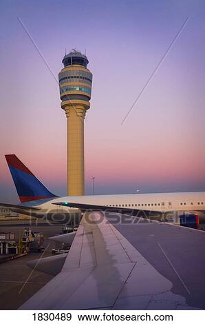 View of control tower out the window of a commercial airplane View Large Photo Image Stock Photo - View of control tower out the window of a commercial airplane . Fotosearch