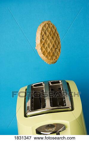Stock Photo - Waffle popping out of toaster. Fotosearch
