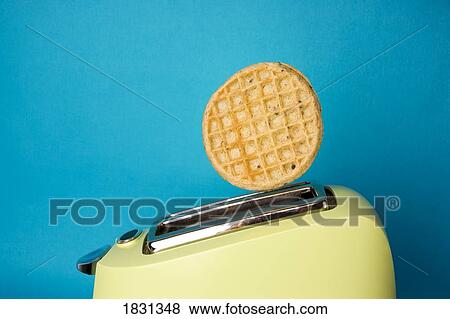 Stock Photo - Waffle popping out of toaster. Fotosearch