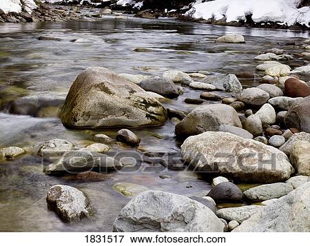 Stock Photo - Water with rocks. Fotosearch
