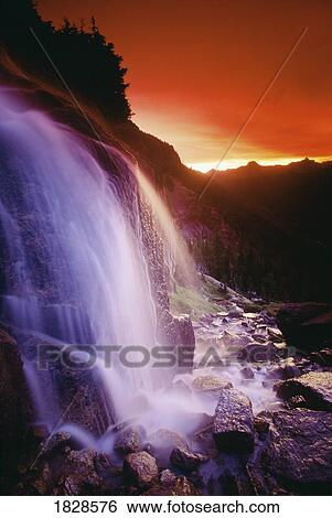 Stock Photograph - Waterfall at sunset, Bugaboo Glacier Provincial Park, British Columbia, Canada. Fotosearch
